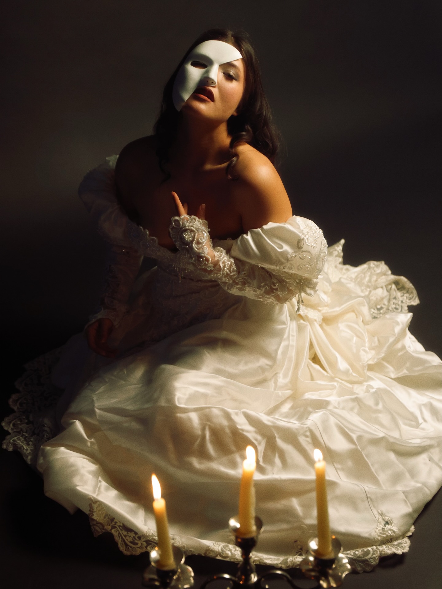 Conceptual bridal portrait with mask and candlelight photographed by Alexis Zolina
