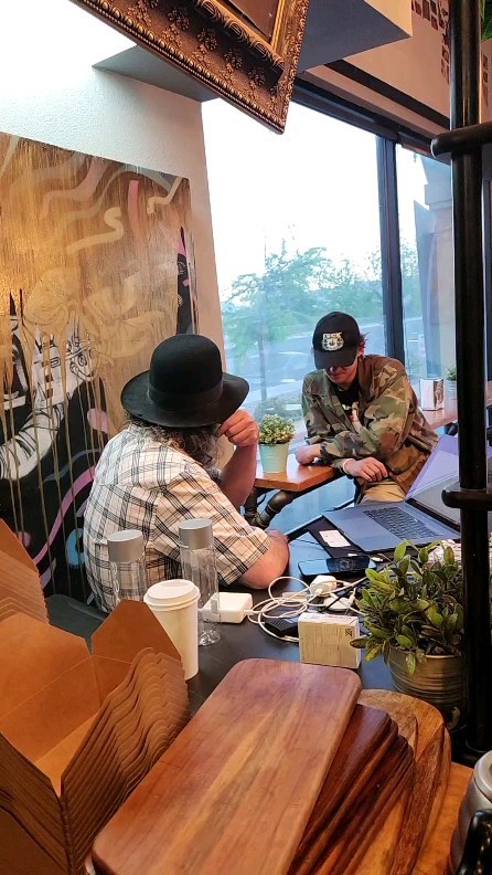 People meeting inside Madhouse Coffee